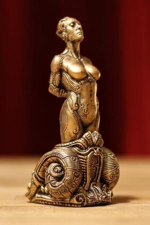 Bound bronze statue of woman