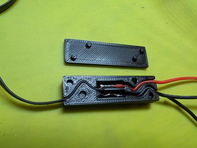 Flat audio wire splice strain relief