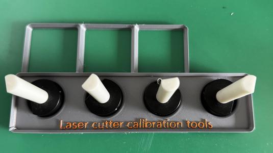 Laser cutter calibration tool organizer