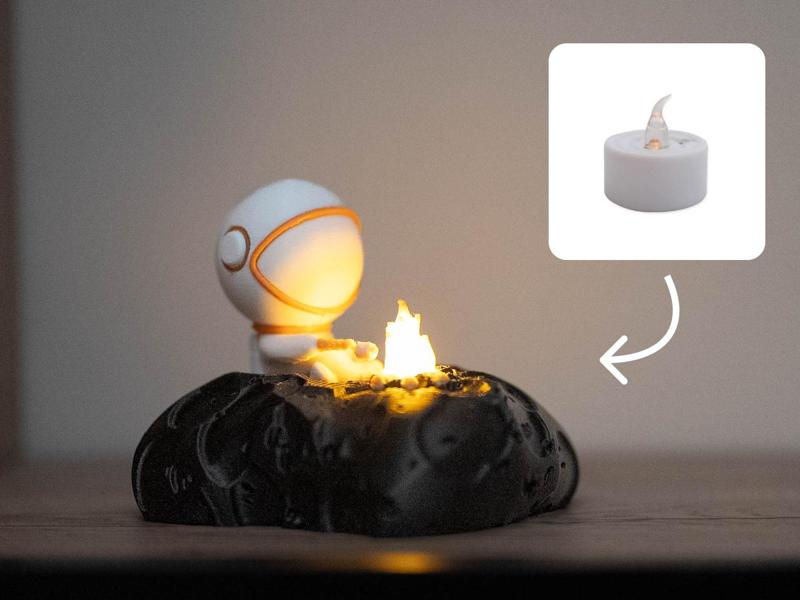 Adorable Astronaut Roasting a Marshmallow on His Asteroid