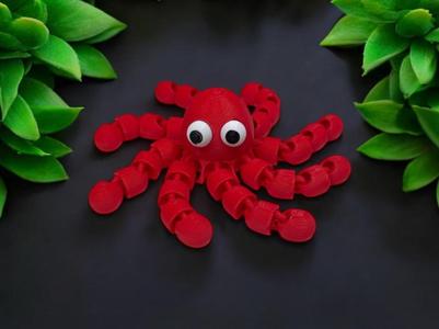 Small articulated octopus in red and white