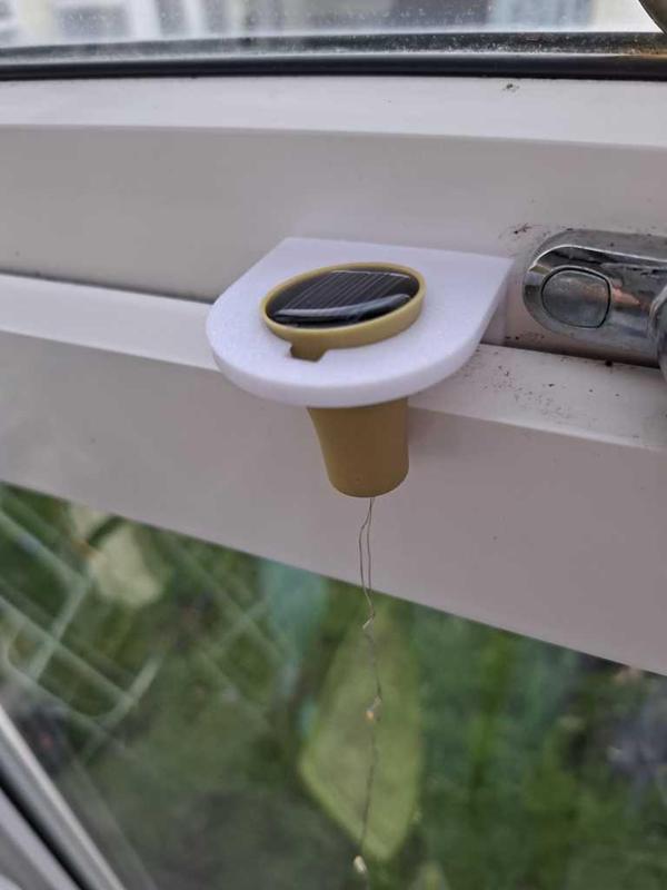 Solar bottle light bracket for a window