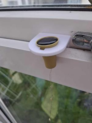 Solar bottle light bracket for a window
