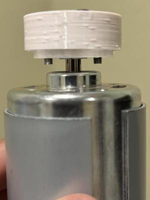 Balanced coupler for smooth motor shaft