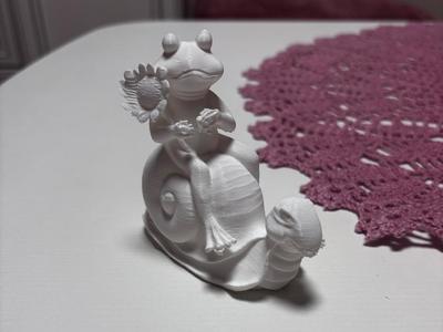 Frog riding a snail garden decoration