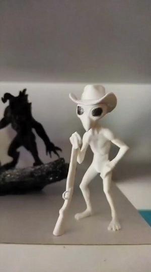 Cowboy Alien with hat and gun