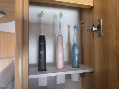 Toothbrush holder for caravan cabinet