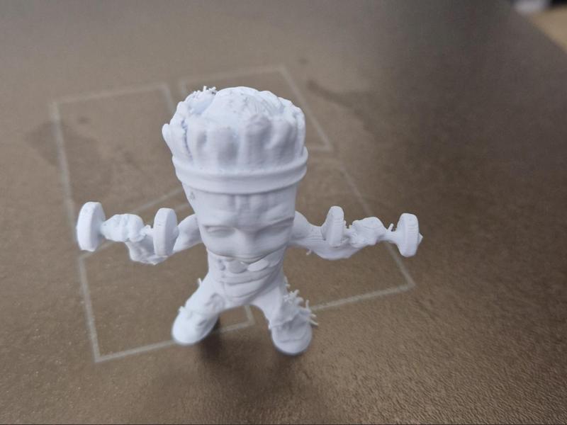 mini Groot with 2 gym weights
