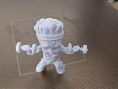 mini Groot with 2 gym weights