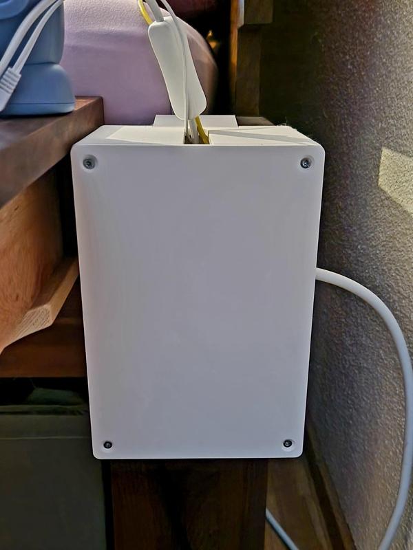 Babyproof powerstrip box with hook