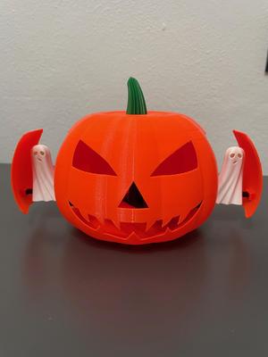 Halloween pumpkin with sliding ghosts