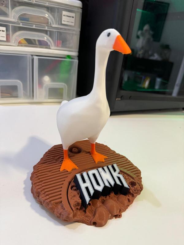 Untitled Goose Game - Entitled Goose Model on a base of destruction with a large HONK logo