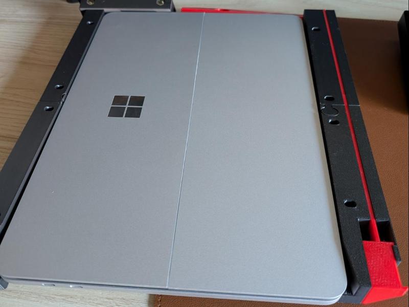 Under-desk docking station for Microsoft Surface laptops