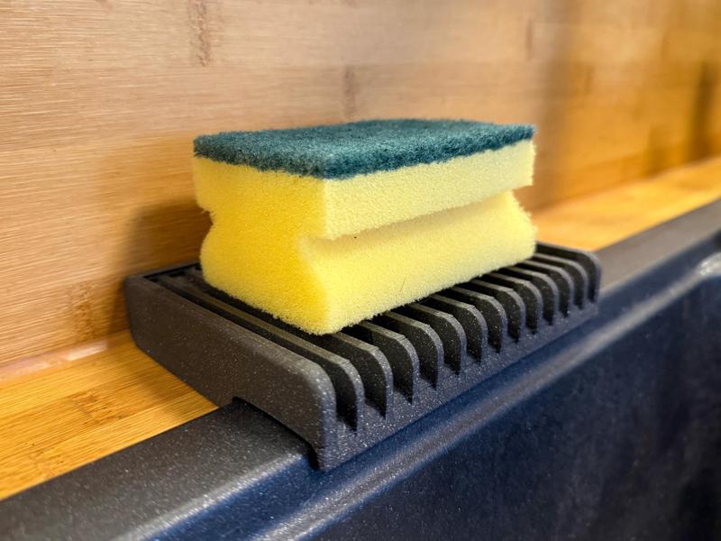 Sponge holder for kitchen sink with rim