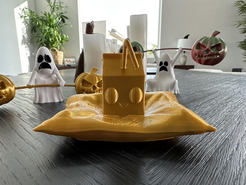 Adorable milk carton on a pillow