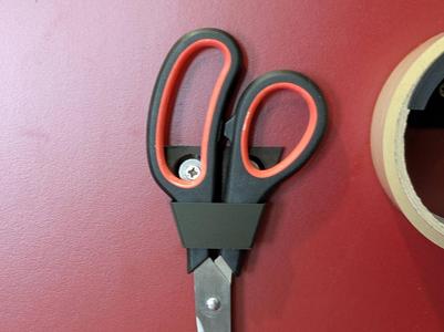 Wall mounted scissors holder