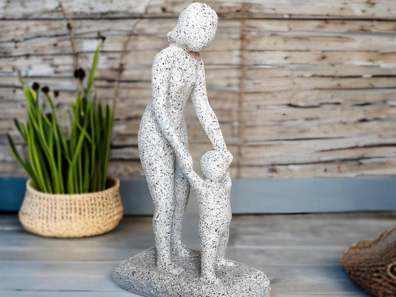 Figure of a Mom Teaching to Walk