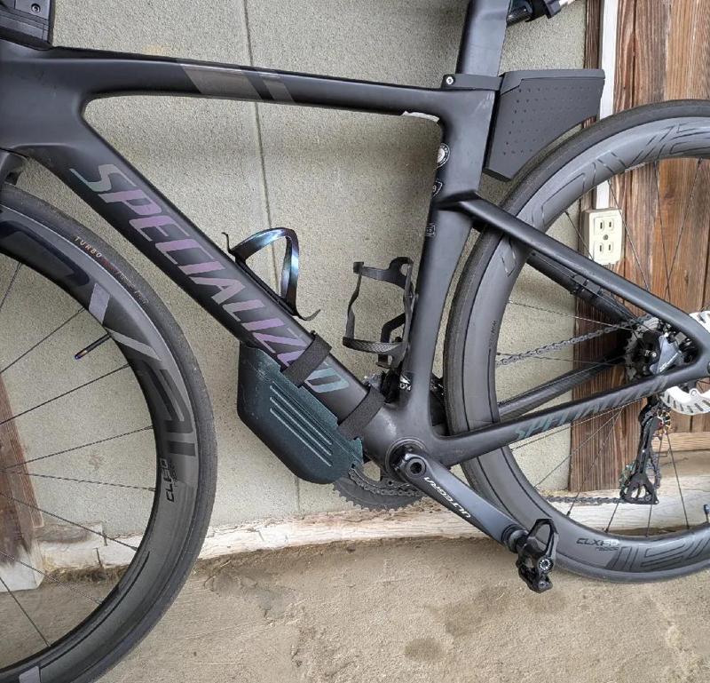 Bike down tube storage box swing open   