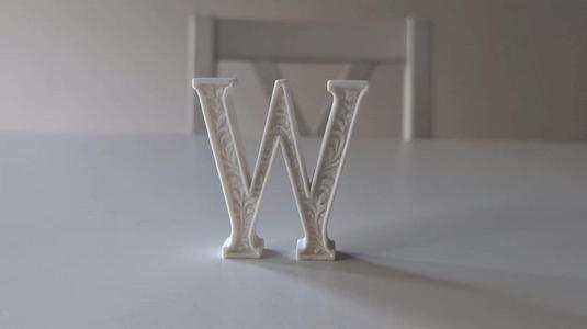 Standing Letter W in a Gypsum Floral Style