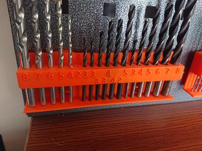 Pegboard, drill bit holder