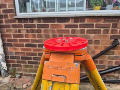 An adapter plate  for mounting to a theodolite  tripod