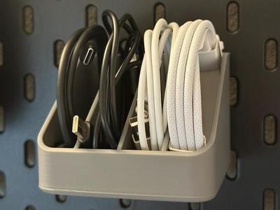 Cable storage for IKEA Skadis Pegboard