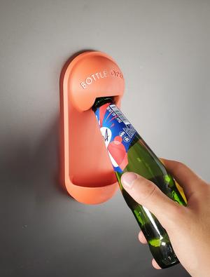 Bottle opener with cap catcher
