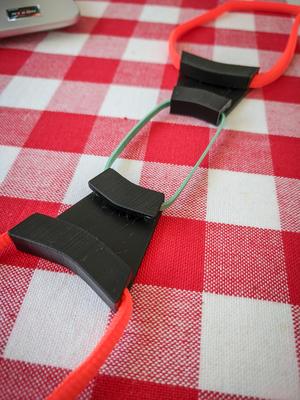 Face mask ear loop tensioner and comfort piece