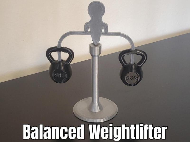 Kinetic Balancing Weightlifter - Spinning Desk Toy