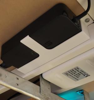 Under desk AC adapter holder for laptops
