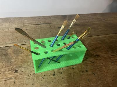 Simple one-piece paint brush holder