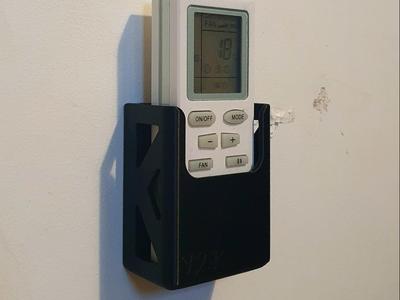 Universal remote wall holder/dock