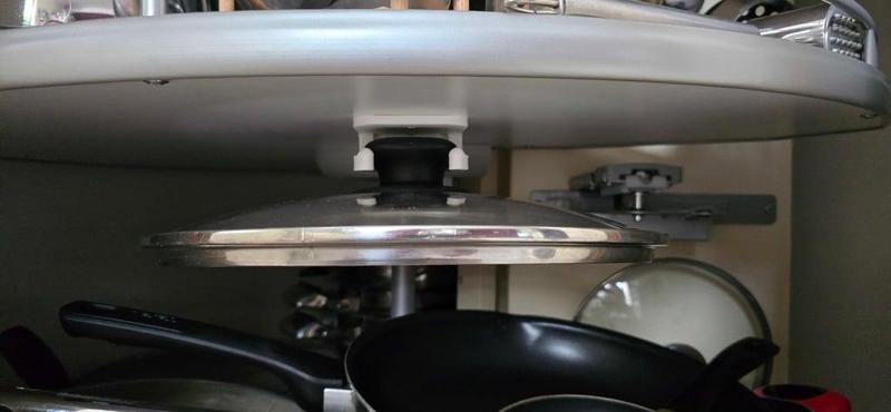 pot lid holder for mounting underneath the carousel