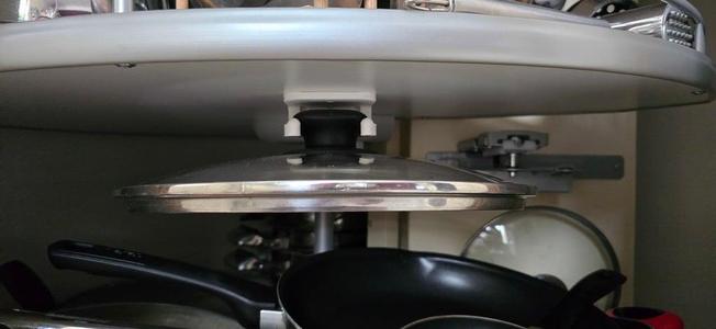 pot lid holder for mounting underneath the carousel
