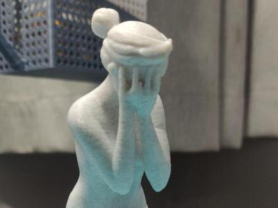 Statue of a Woman holding hands
