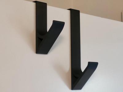 Over door hook for coat hangers, towels etc