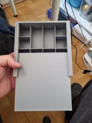 Compartmentalized box with a lid