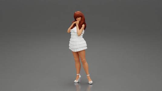 Beautiful woman with long hair standing and posing in fashion summer dress