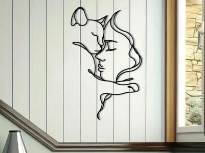 Wall decoration with a silhouette of a cat and a woman