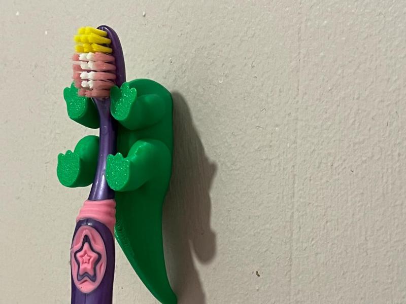 dinosaur toothbrush holder