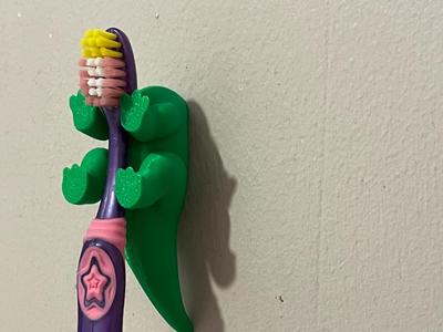 dinosaur toothbrush holder