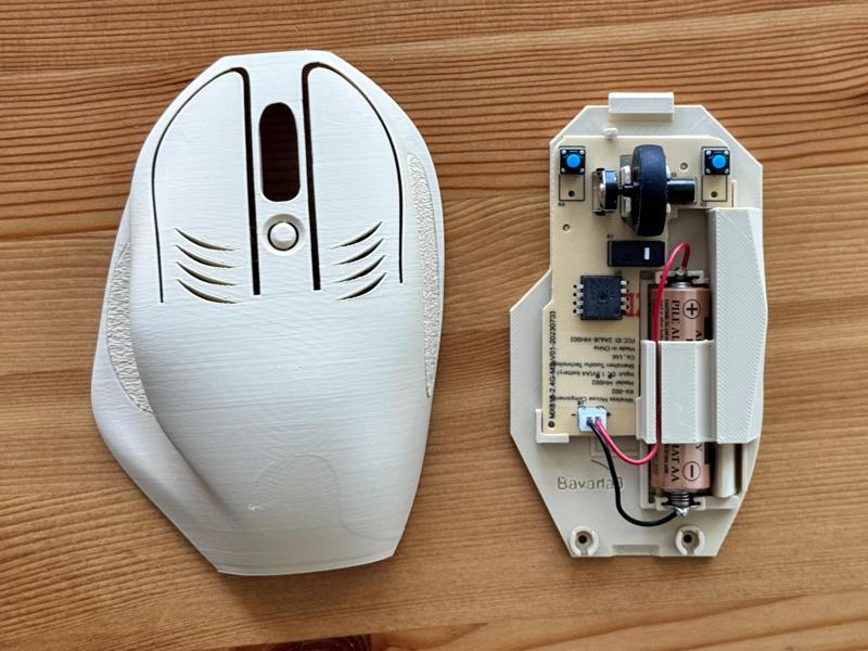 Ergonomic wireless mouse with USB-C storage dock