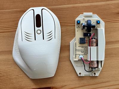 Ergonomic wireless mouse with USB-C storage dock