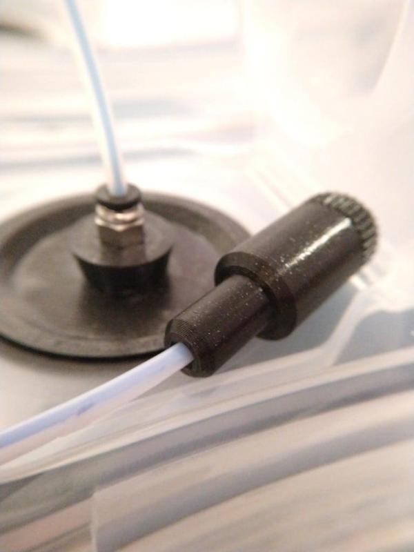 Filament feed tube end cap