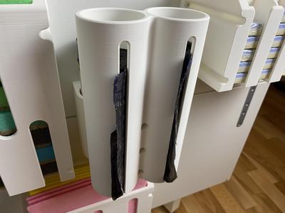 Garbage bag organizer for kitchen cabinet