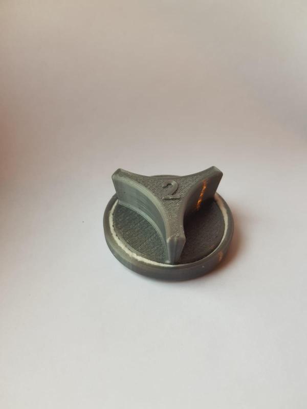 A cotton pad holder for applying glue and cleaning the 3D printer printing table.