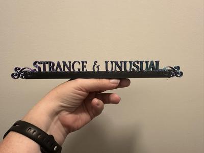 Strange and Unusual Desk Plaque