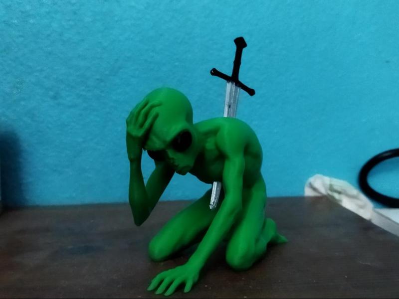 Dying Alien in Pain by Sword