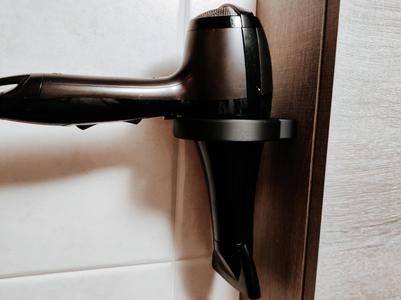 Wall hanging hair dryer holder