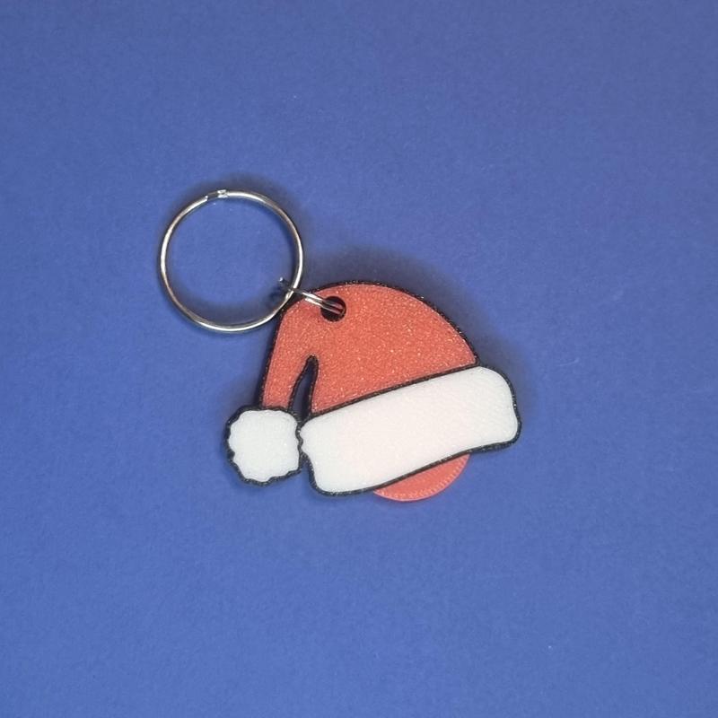 Portachiavi cappello babbo natale con gettone per carrello della spesa